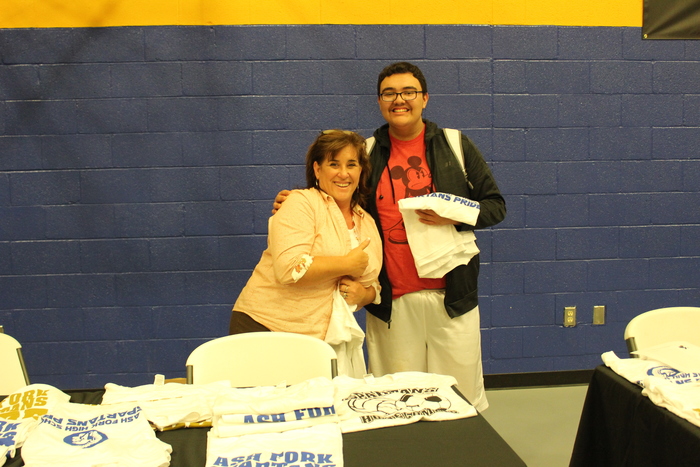 Ms. Sue helping give away T-Shirts